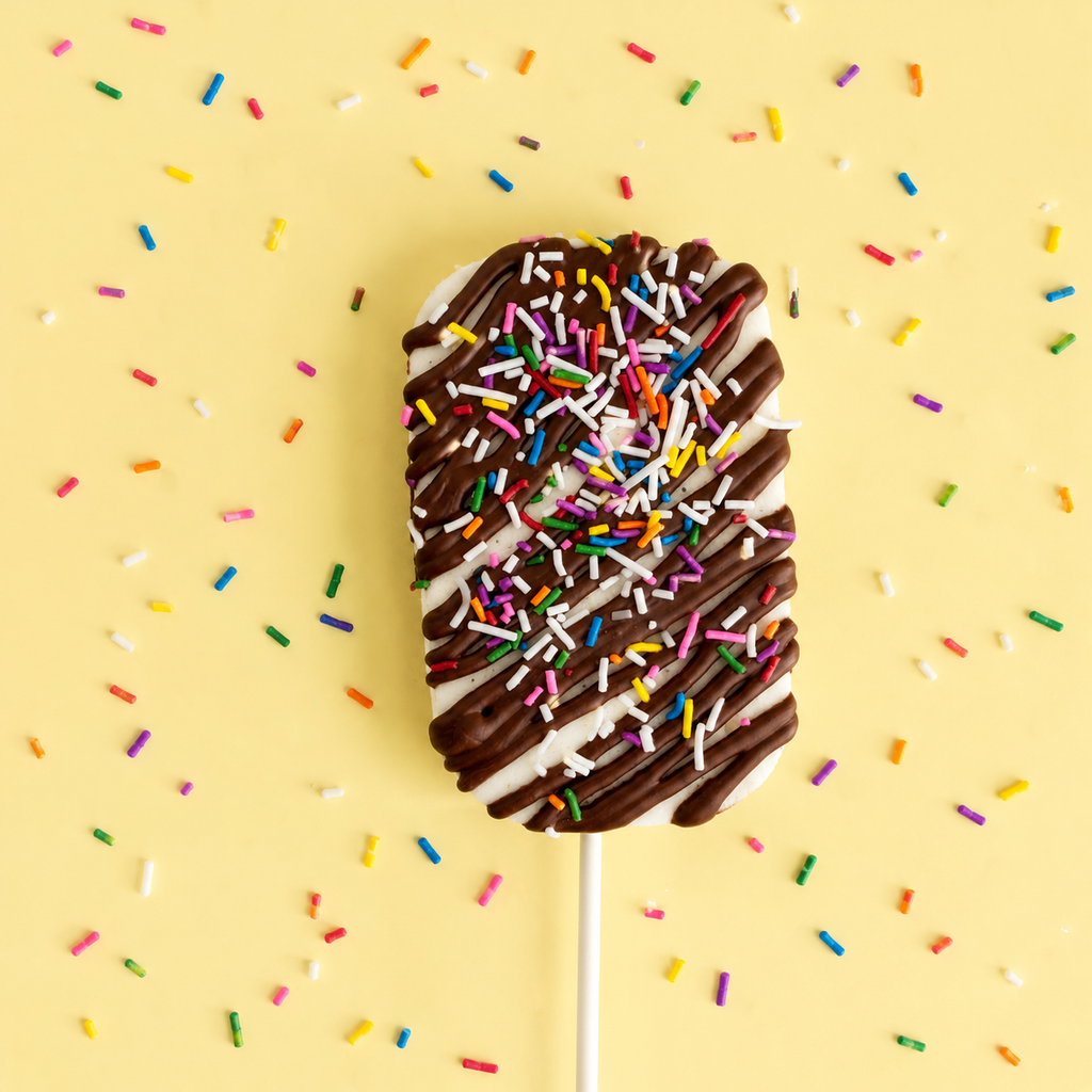 Drizzle Me This gourmet marshmallow pop with milk chocolate drizzle and rainbow sprinkles
