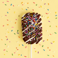 Drizzle Me This gourmet marshmallow pop with milk chocolate drizzle and rainbow sprinkles