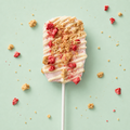 Strawberry marshmallow stopped with white chocolate drizzle, freeze dried strawberries and graham cracker crumble.